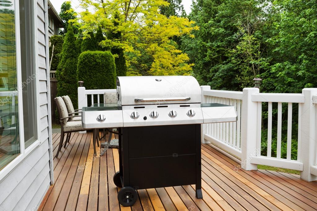 BBQ grill on wooden deck